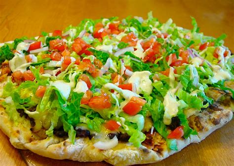 How does Tostada Pizza fit into your Daily Goals - calories, carbs, nutrition