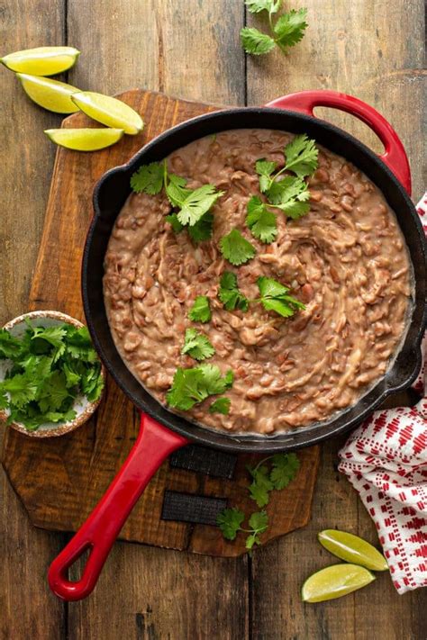 How does Traditional - Refried Beans-Aaj fit into your Daily Goals - calories, carbs, nutrition