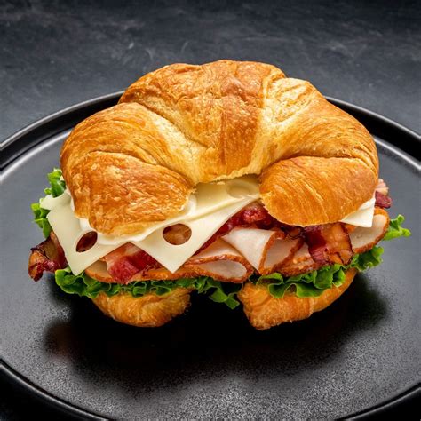 How does Turkey Club Croissant fit into your Daily Goals - calories, carbs, nutrition