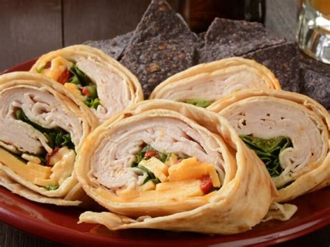 How does Turkey and American Cheese Wrap withPotato Salad fit into your Daily Goals - calories, carbs, nutrition