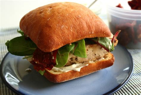 How does Tuscan Chicken Sandwich with Sun-Dried Tomato Vinaigrette and Potato Salad fit into your Daily Goals - calories, carbs, nutrition