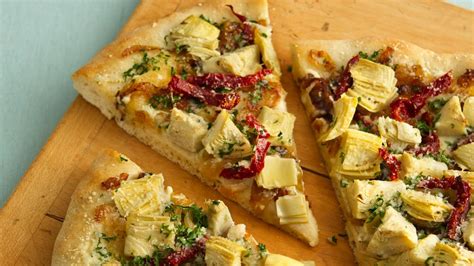 How does Vegan Pizza with Artichoke Hearts fit into your Daily Goals - calories, carbs, nutrition