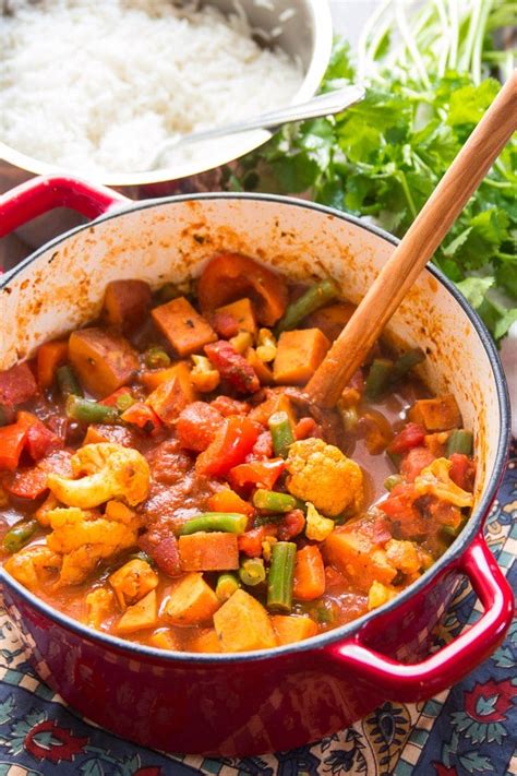 How does Vegetable Vindaloo over Roasted Sweet Potato Quinoa with Mango Salsa fit into your Daily Goals - calories, carbs, nutrition