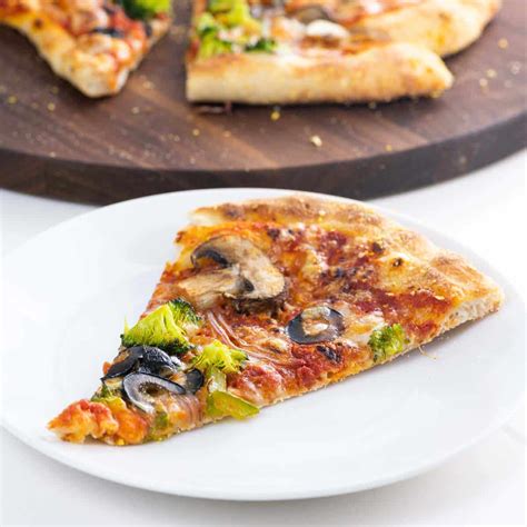 How does Vegetarian Supreme Pizza Slice fit into your Daily Goals - calories, carbs, nutrition