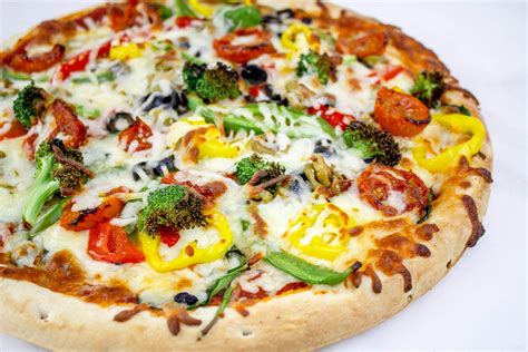 How does Veggie Deluxe Pizza fit into your Daily Goals - calories, carbs, nutrition