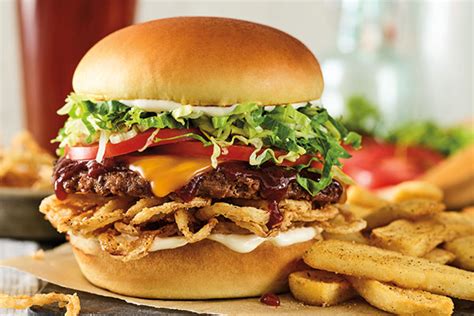 How does Whiskey River BBQ Burger with chips fit into your Daily Goals - calories, carbs, nutrition