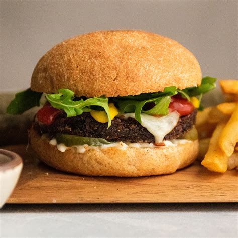 How does Wolverine Burger with Wheat Bun fit into your Daily Goals - calories, carbs, nutrition