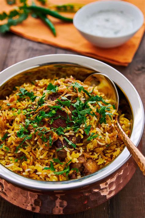 How many calories are in tender pieces of chicken cooked in an authentic biryani sauce and served with basmati rice - calories, carbs, nutrition