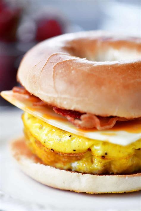 How many carbs are in fast foods, bagel, with egg, sausage patty, cheese, and condiments - calories, carbs, nutrition