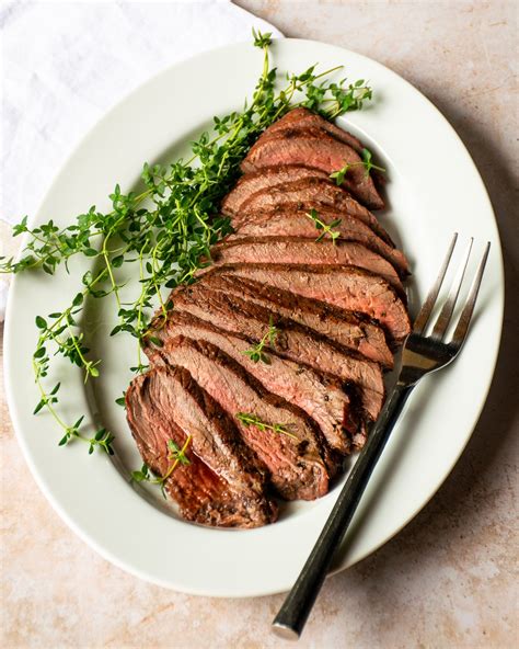 How many carbs are in grilled marinated london broil demi-glace with sauteed asparagus tips roast fingerling potatoes-occ - calories, carbs, nutrition