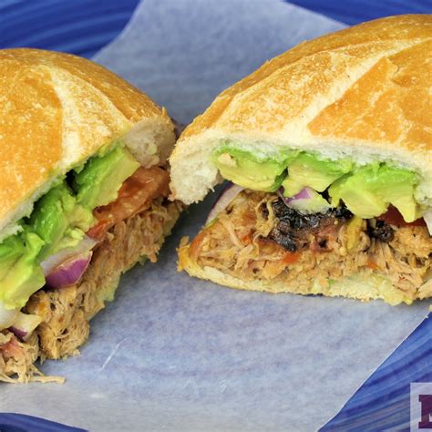 How many carbs are in mexican pork tortas in a crusty roll with refried beans & wedges - calories, carbs, nutrition