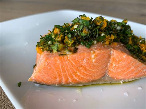 How many carbs are in olive oil poached salmon with orange broth, white bean kale, blistered tomato - calories, carbs, nutrition