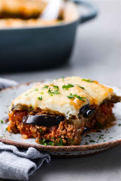 How many carbs are in oven baked lamb moussaka with a golden cheese crust, garlic bread & side salad - calories, carbs, nutrition