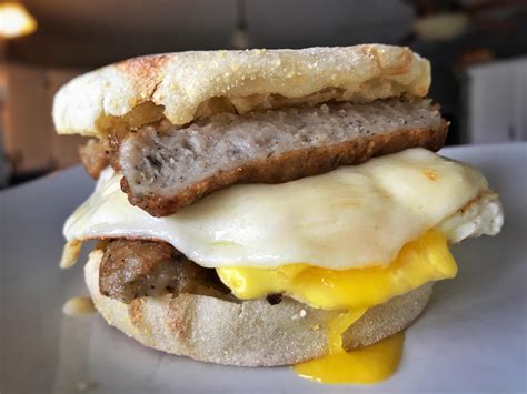 How many carbs are in sand brkf english muffin sausage fried egg white & cheese - calories, carbs, nutrition