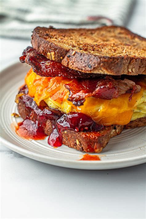 How many protein are in bacon, egg and cheese on wheat toast - calories, carbs, nutrition