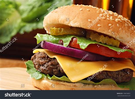 How many protein are in cheeseburger 4 oz lettuce tomato pickle chips unseeded bun - calories, carbs, nutrition