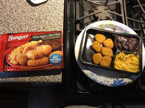 How many protein are in cosmic chicken nuggets - with macaroni in cheese sauce, corn in a seasoned sauce, and chocolate pudding with rainbow sprinkles, frozen meal - calories, carbs, nutrition