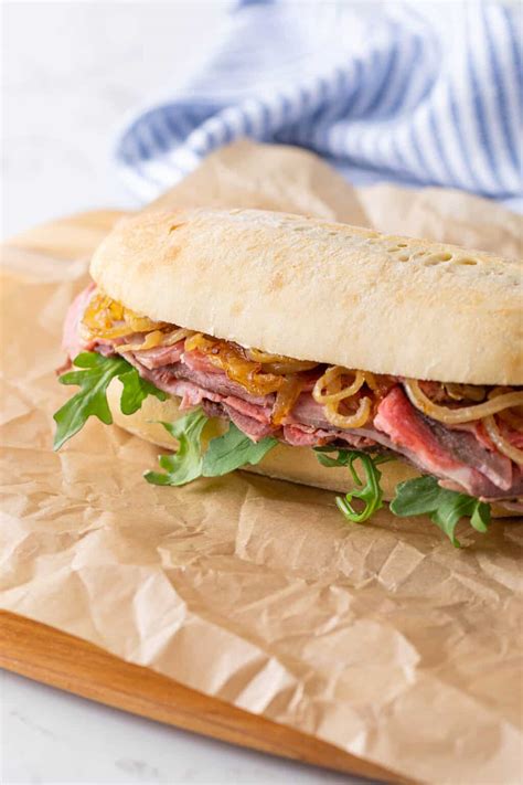 How many protein are in rib sandwich with onion roll - calories, carbs, nutrition