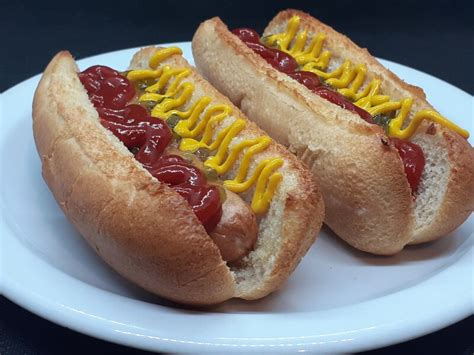 How many protein are in steamed hot dog with jalape?o chillies, sweet chilli sauce & grated cheddar cheese - calories, carbs, nutrition