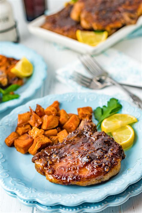 How many sugar are in apple smoked pork chops with dijon-bourbon glaze, baked sweet potato fries and braised kale - calories, carbs, nutrition