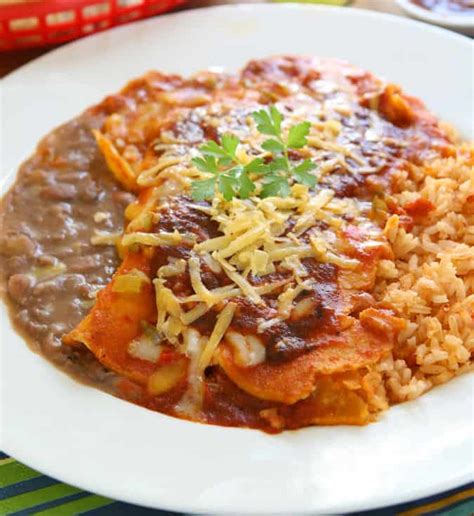 How many sugar are in chicken enchiladas with pinto beans and mexican rice - calories, carbs, nutrition