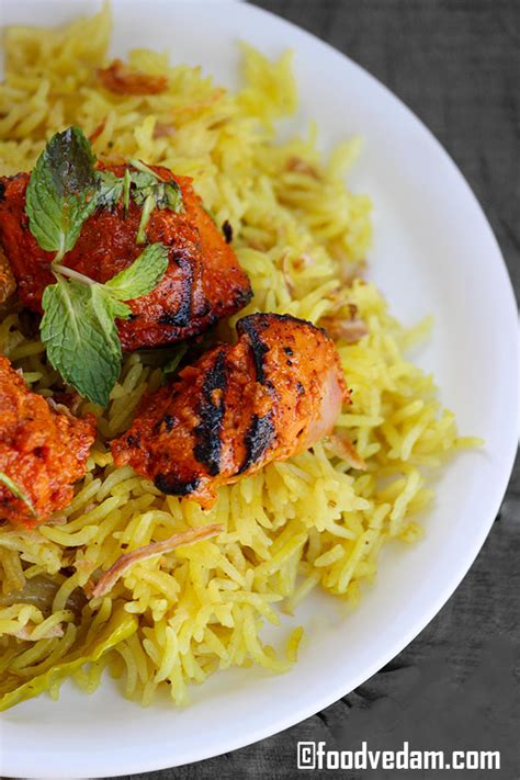 How many sugar are in chicken thigh tikka skewer pulai rice cardamom cauliflower & kachoombar salad - calories, carbs, nutrition