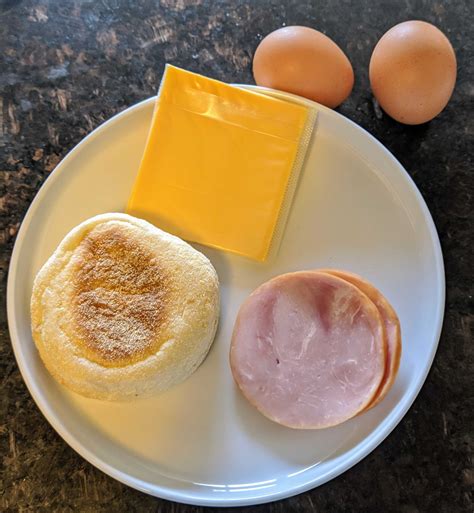 How many sugar are in fried egg o'muffin with ham, american cheese - calories, carbs, nutrition