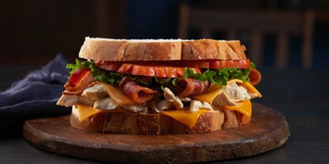 How many sugar are in grilled chicken sandwich on sourdough w/bacon and ranch dressing - calories, carbs, nutrition
