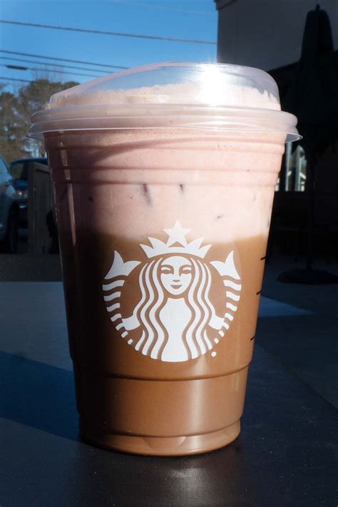 How many sugar are in iced raspberry mocha - grande - whole milk - with whipped cream - calories, carbs, nutrition