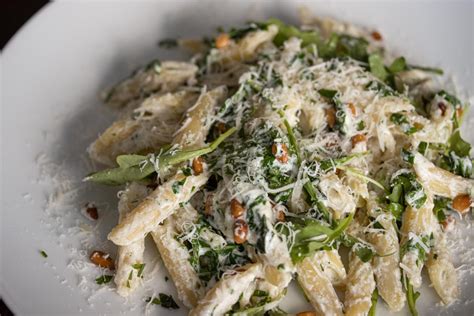 How many sugar are in pasta, chicken, arugula, pine nuts, parmesan, olive oil & fettuccini - calories, carbs, nutrition