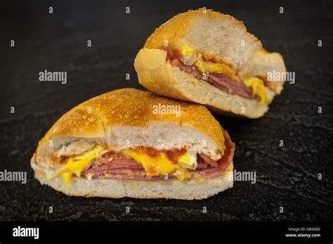 How many sugar are in sand brkf kaiser roll ham egg & cheese - calories, carbs, nutrition