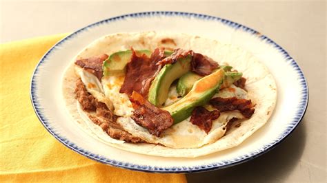 How many sugar are in sand brkf wrap huevos rancheros egg whites - calories, carbs, nutrition