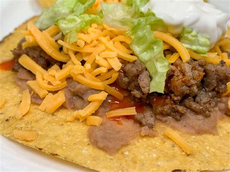 How many sugar are in taco beef tostada - calories, carbs, nutrition