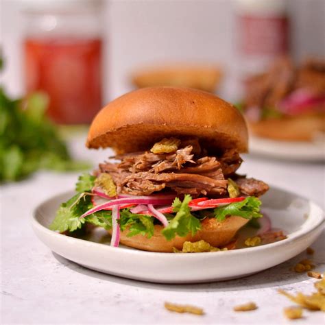 How many sugar are in the canadiana burger w/ pulled beef - calories, carbs, nutrition