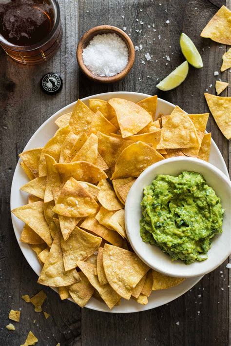 How many sugar are in tortilla chips yellow baked 2 oz - calories, carbs, nutrition