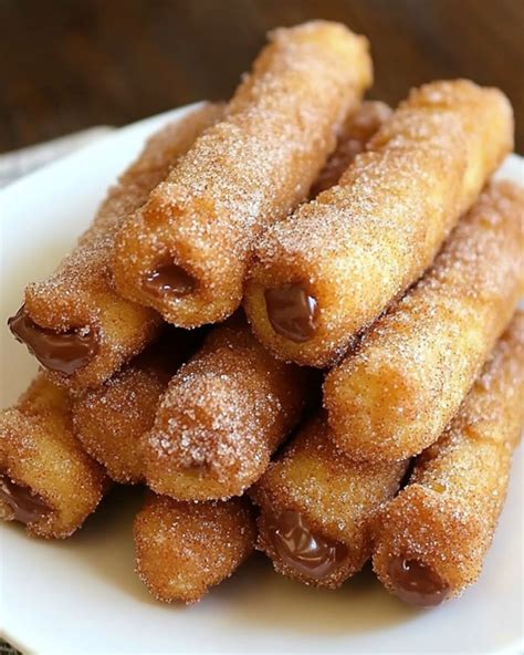How many sugar are in warm churros coated in cinnamon sugar & served with chocolate sauce - calories, carbs, nutrition