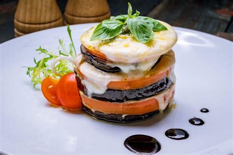 How much fat is in eggplant - tomato - pesto stack - kale caesar - calories, carbs, nutrition