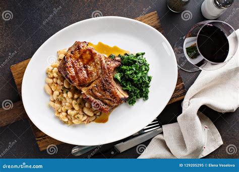 How much fat is in grilled pork chops over white bean cassoulet with braised spinach - calories, carbs, nutrition