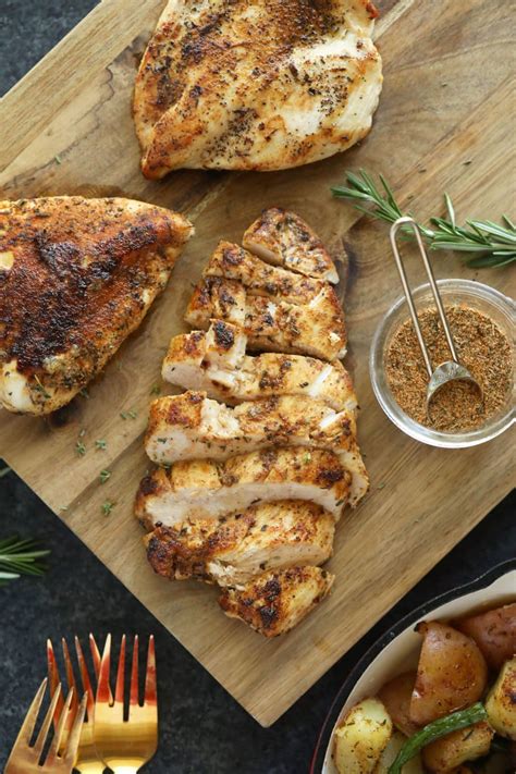 What seasonings can I use to flavor the frozen chicken breasts?