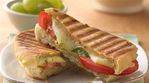 Cheese & Tomato Panini Garnished with Mixed Leaves - calories, carbs, nutrition