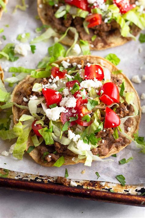 Fast foods, tostada, with beans, beef, and cheese - calories, carbs, nutrition