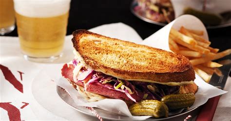 Grilled Reuben Sandwich with French Fries and a 20oz Fountain Beverage - calories, carbs, nutrition