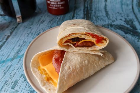 Grilled Sausage, Bacon, Pudding, Hash Brown & Fried Egg Wrap - calories, carbs, nutrition