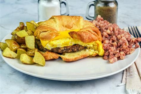 Sausage, Egg Cheese Croissant Platter with Homefries and Honeydew - calories, carbs, nutrition