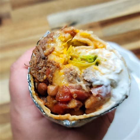 Shredded Beef Burrito with refried beans, spanish rice, sour cream and salsa - calories, carbs, nutrition