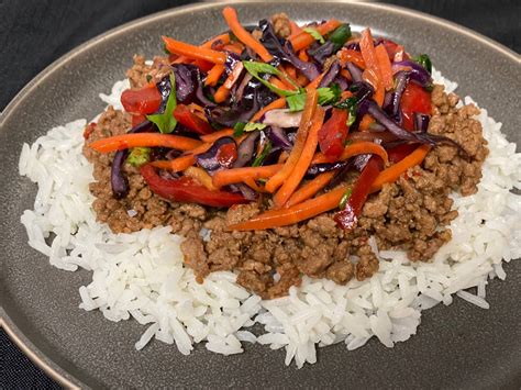 Sliced Thai Beef Medallions over Jasmine Rice with Fried Quail Egg - calories, carbs, nutrition