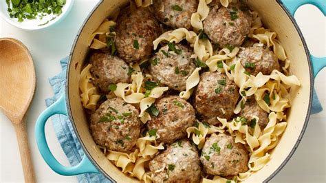 Swedish Meatballs over egg noodles with dinner roll and sour cream - calories, carbs, nutrition