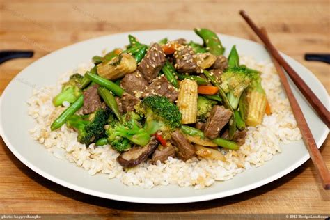 Szechwan Beef Stir-Fry served over Steamed Rice with a Summer Squash and Broccoli Saute - calories, carbs, nutrition